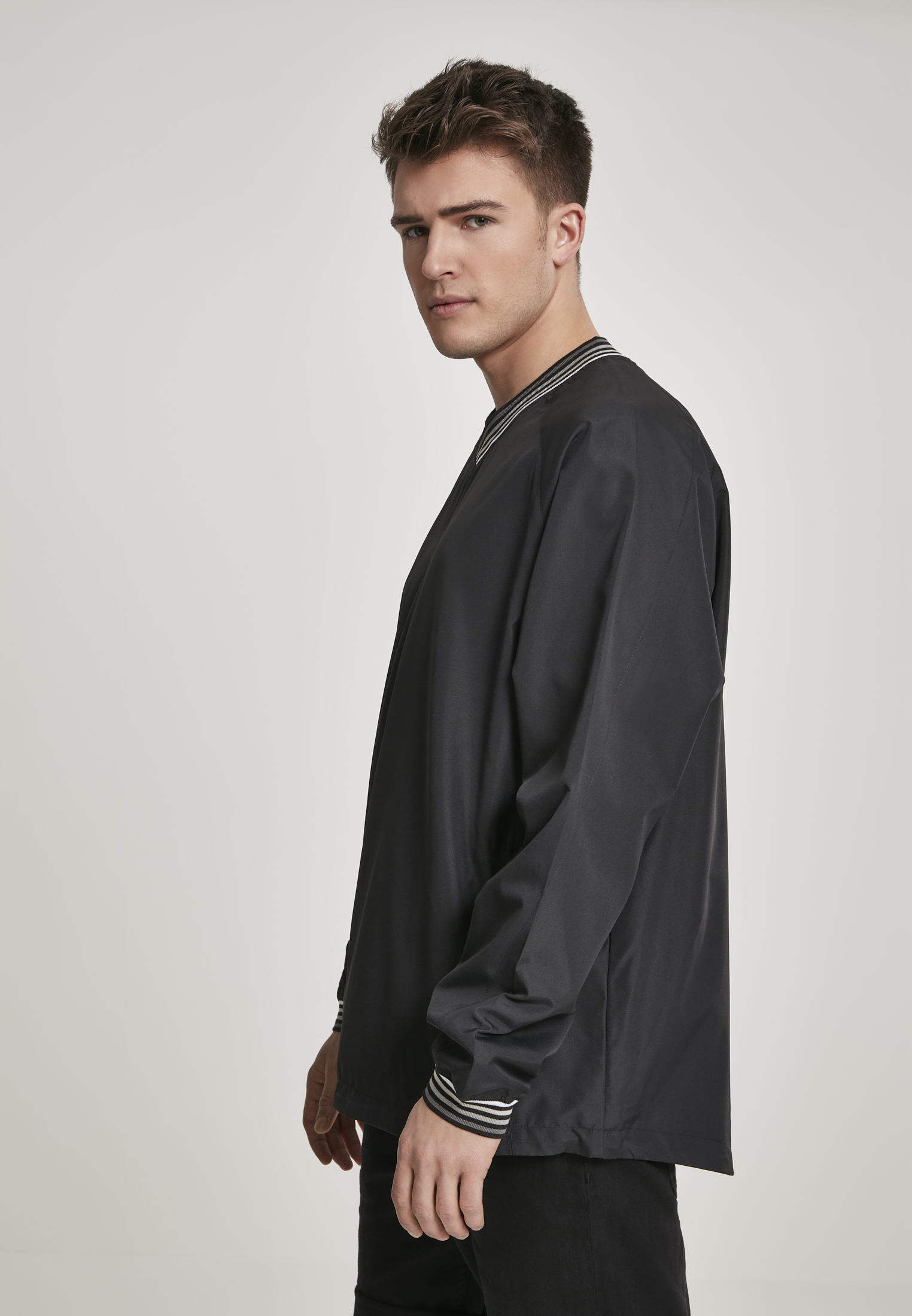 Light Jackets Warm Up Pull Over in Farbe blk/gry